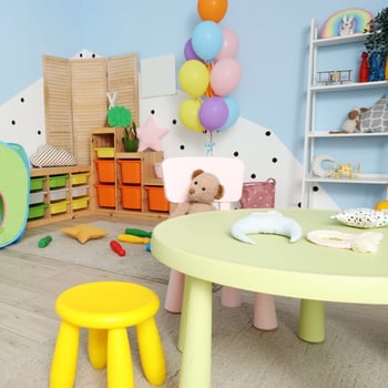 Basement playroom and teen hangout space with seating and open area