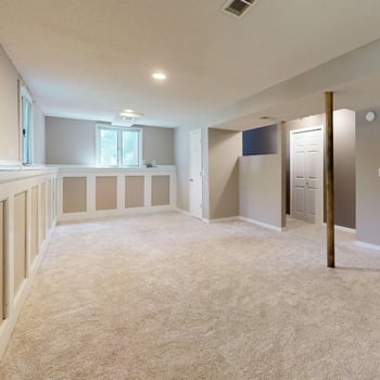Open concept finished basement with lounge, fitness, and flexible space